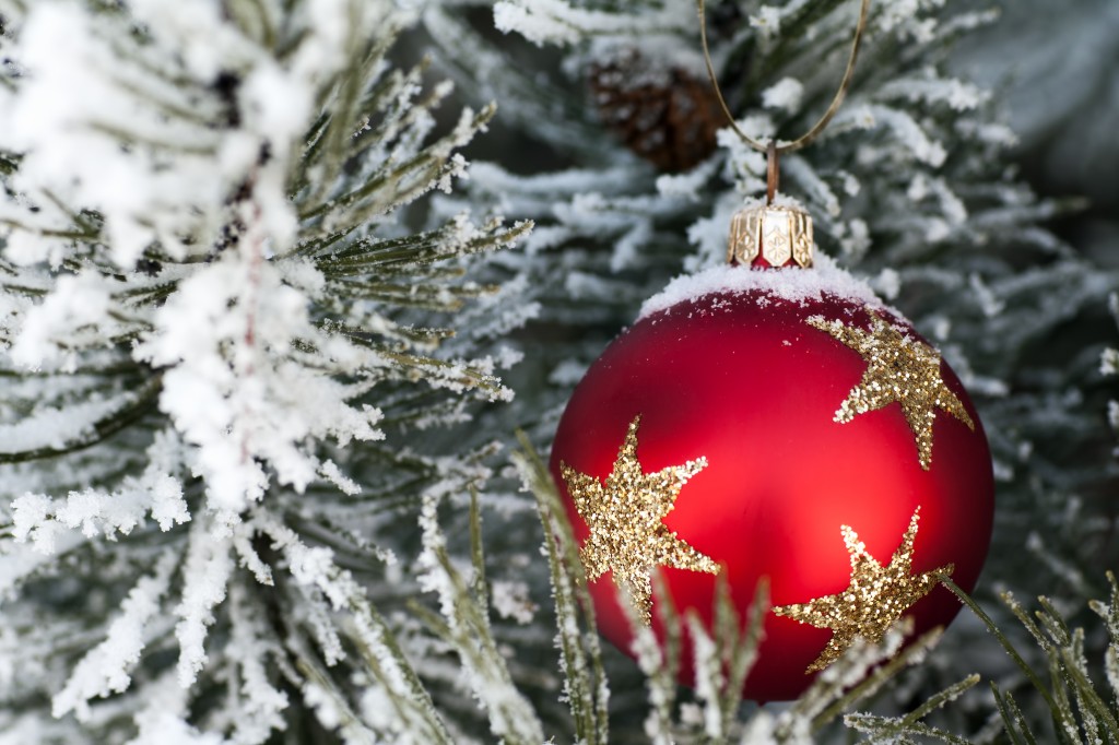 Snow on red christmas bauble