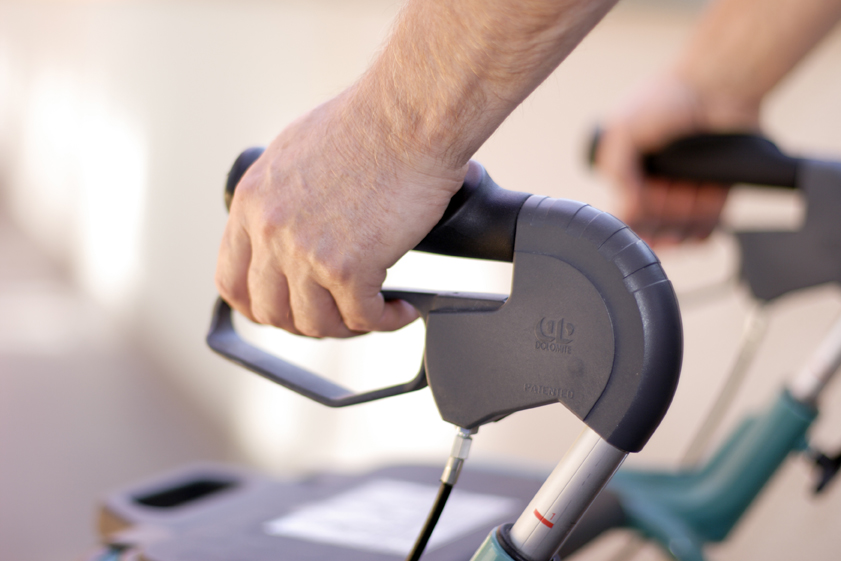 closeup of senior hands on rollator's handles