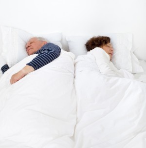 Senior couple in bed asleep_dreamstime_13822577